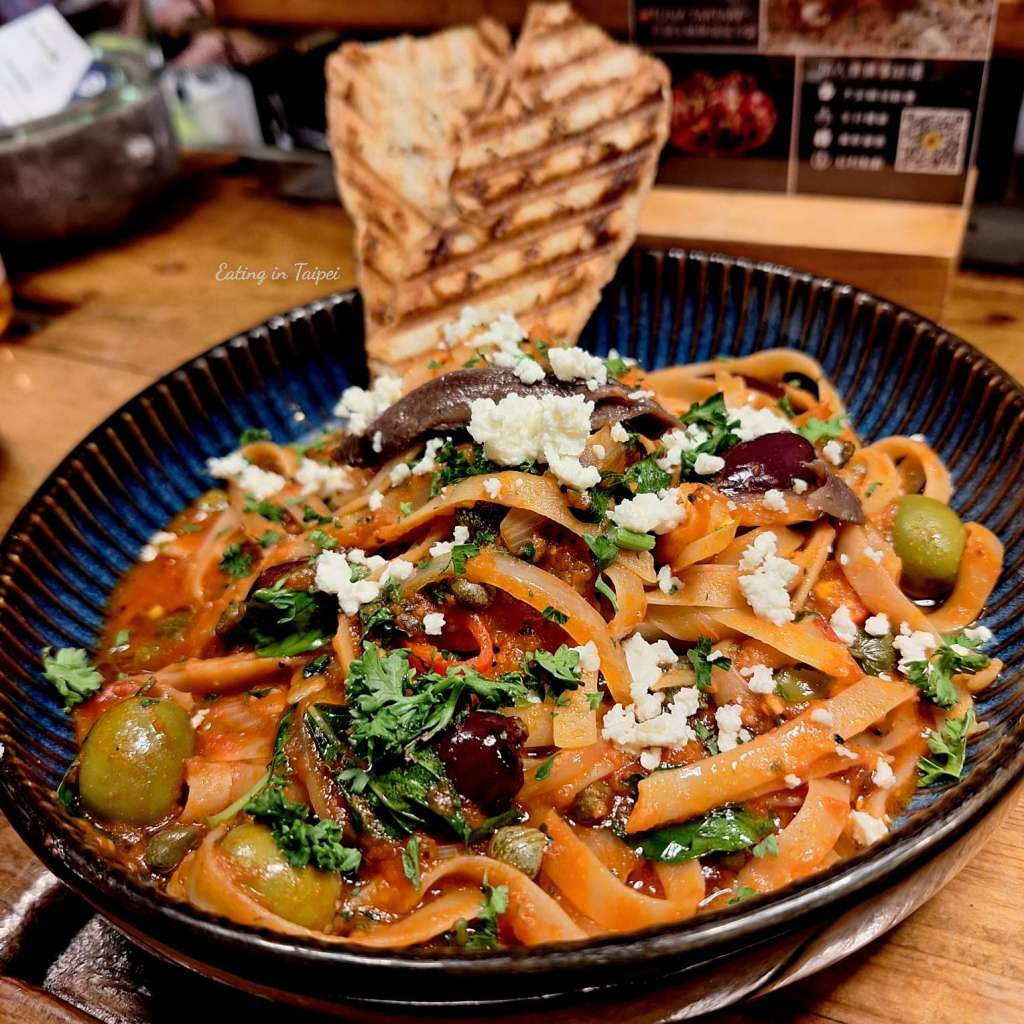 Toasteria Cafe Putanesca pasta. Lots of olives, feta, and capers are topping fettucini 
